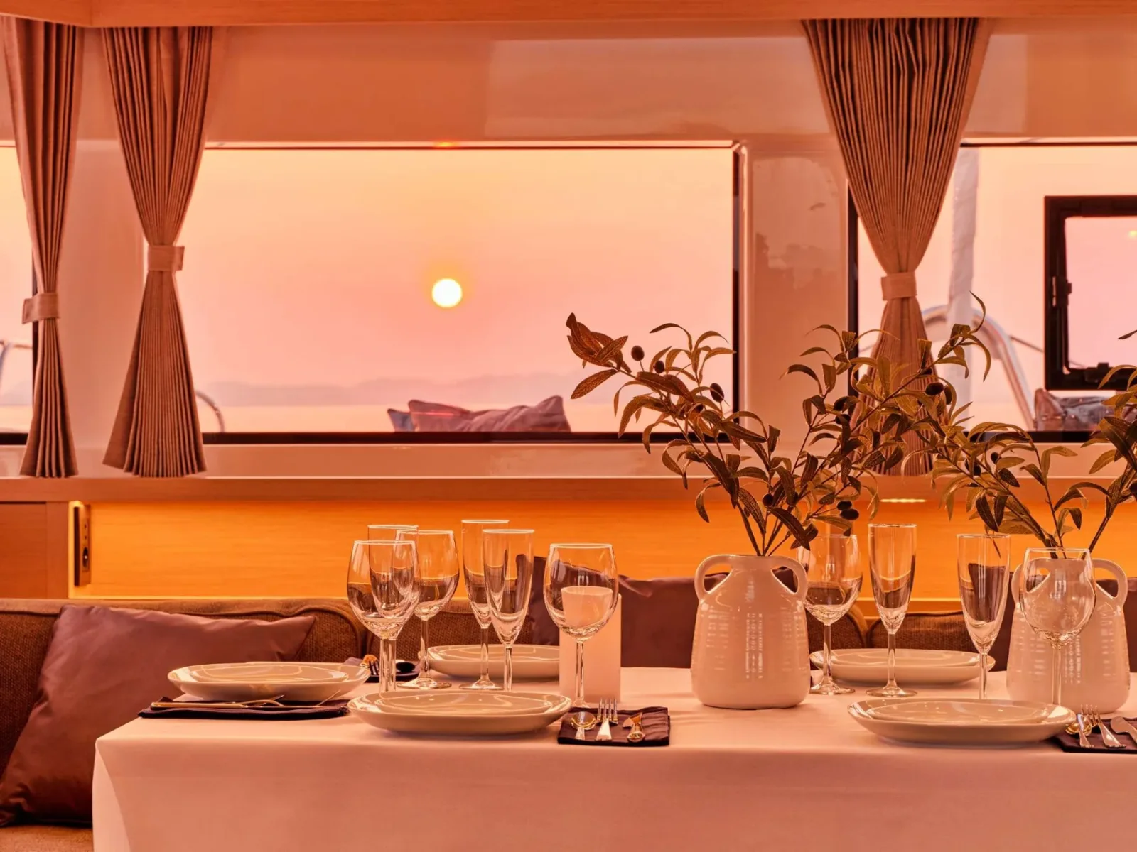 Lagoon 55 AZUL – Saloon dining at sunset