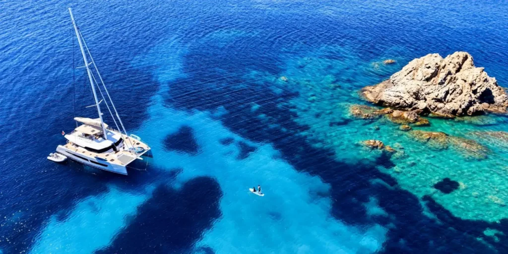 Fountaine Pajot Alegria 67 BLUESATION – aerial view in a cove