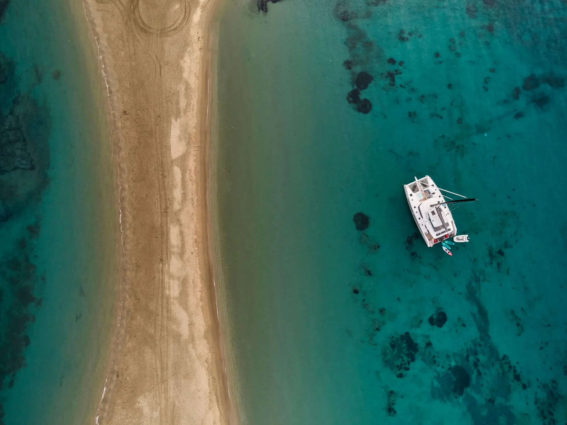 Alegria 67 DOLLY – Aerial view off a sandbar anchorage