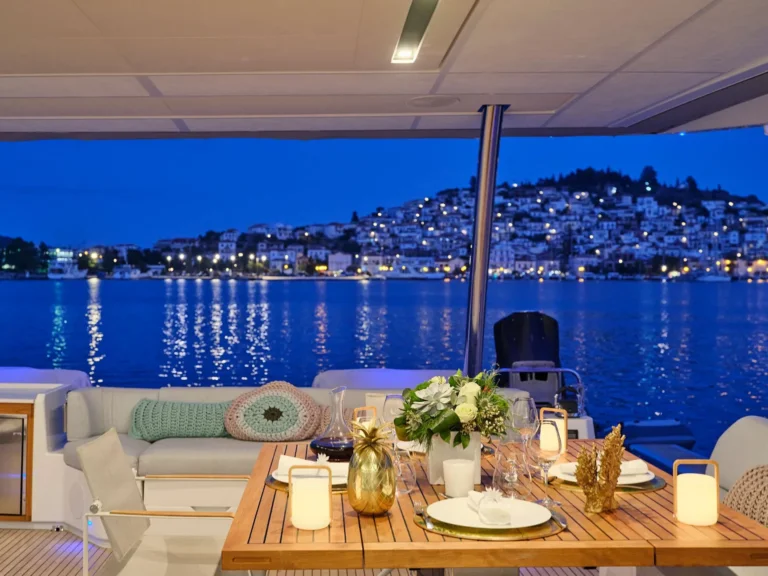 Fountaine Pajot Alegria 67 KIMATA – Aft deck dining by night