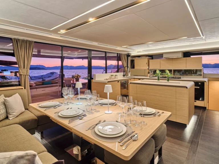 Fountaine Pajot Alegria 67 SUNMOON – Saloon dining at sunset