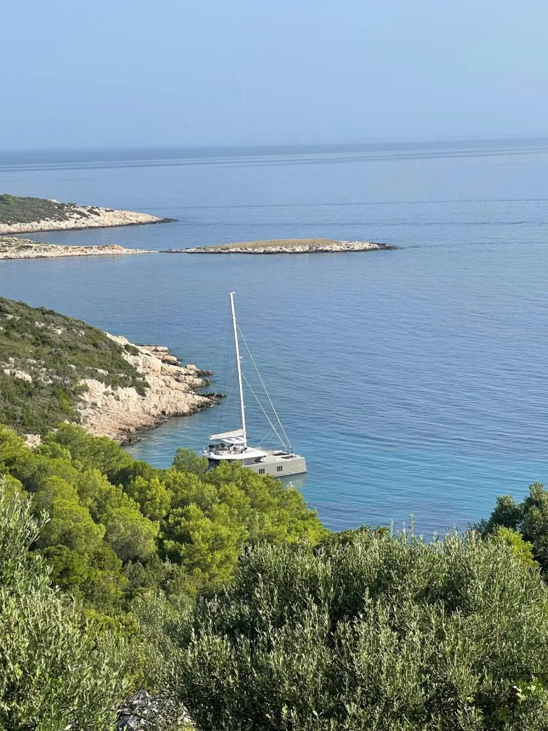 Sunreef 60 VULPINO – at anchor in a cove