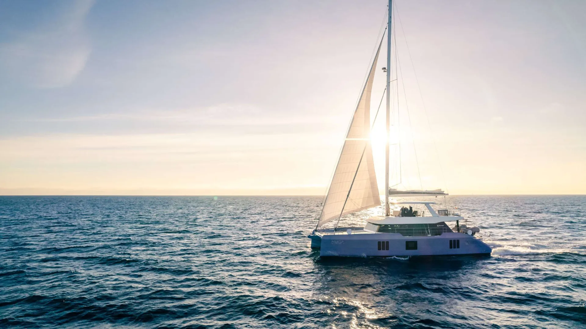 Sunreef 70 AGATA BLU – Under sail at sunset
