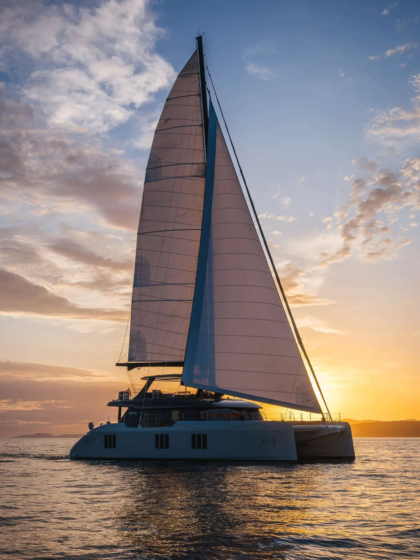 Sunreef 70 n+1 – Under sail at sunset