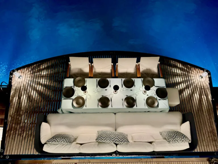 Sunreef 77 ONE PLANET – Aft deck dining by night