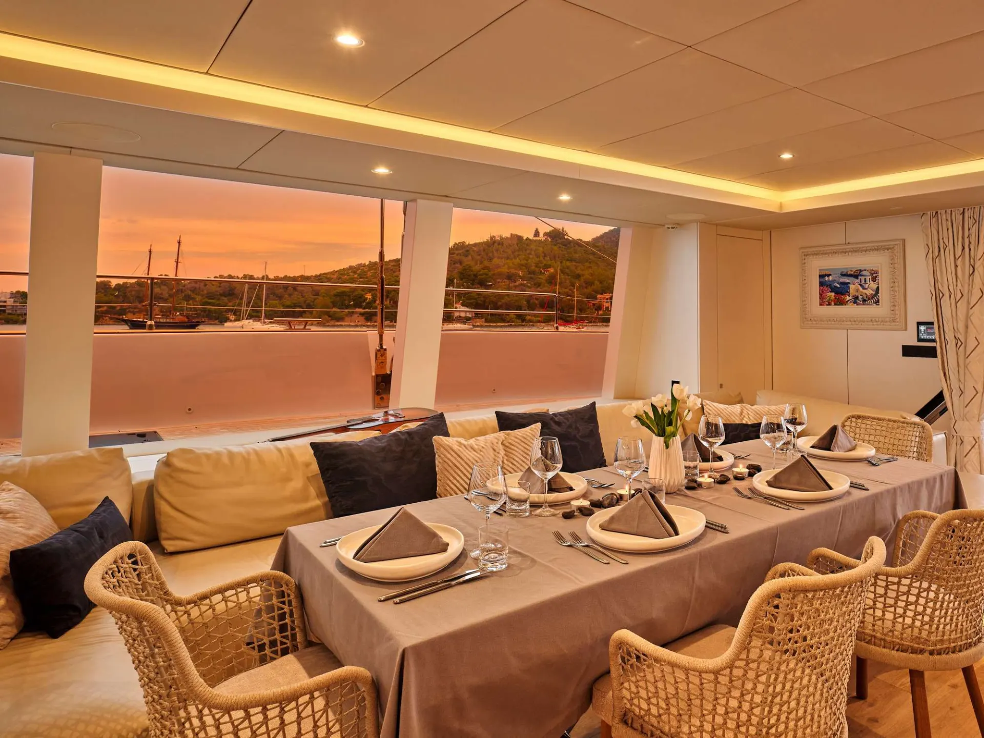Sunreef 80 GENNY – Saloon dining at sunset