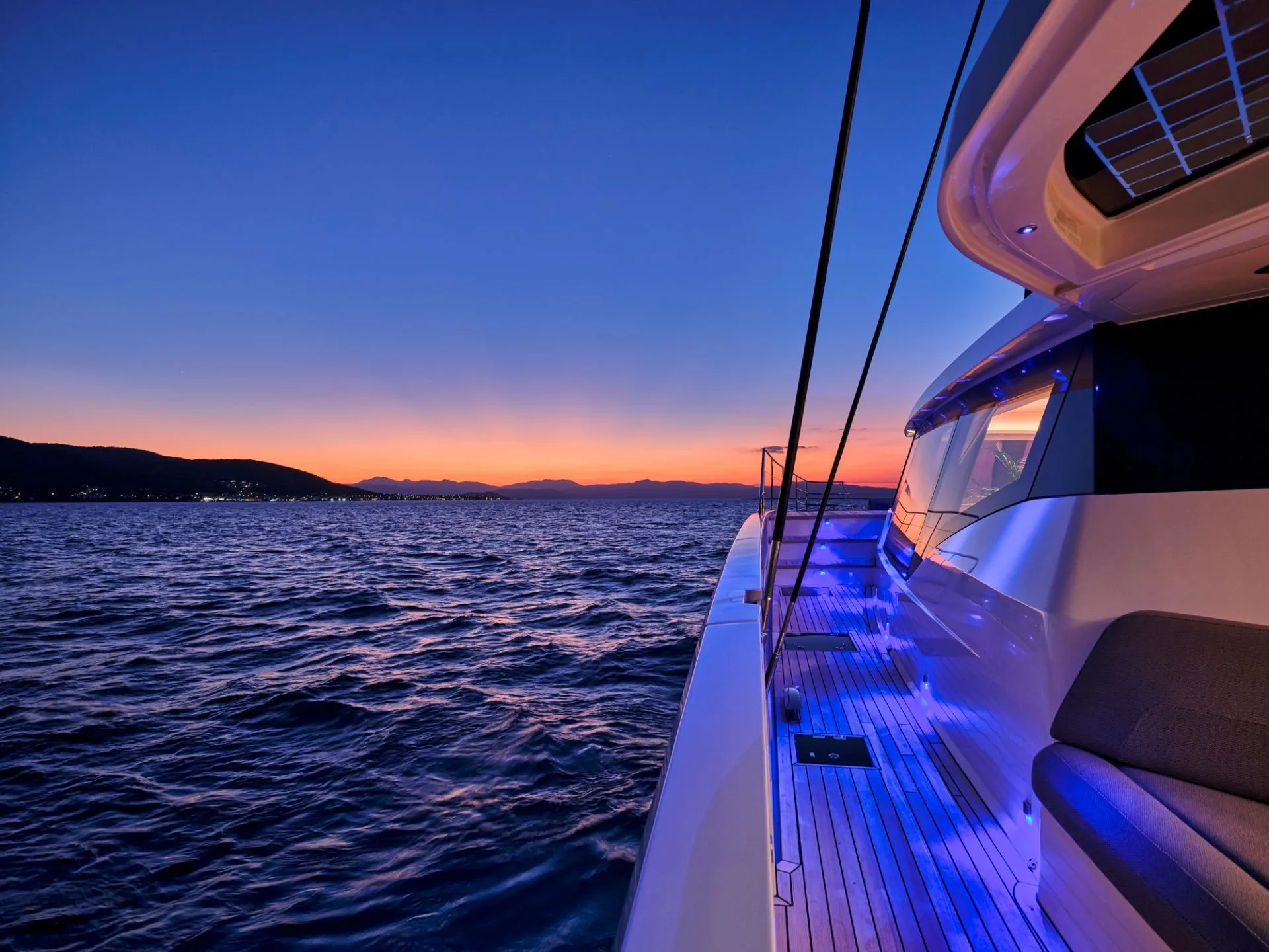 Thira 80 ALOIA 80 – Side deck at dusk